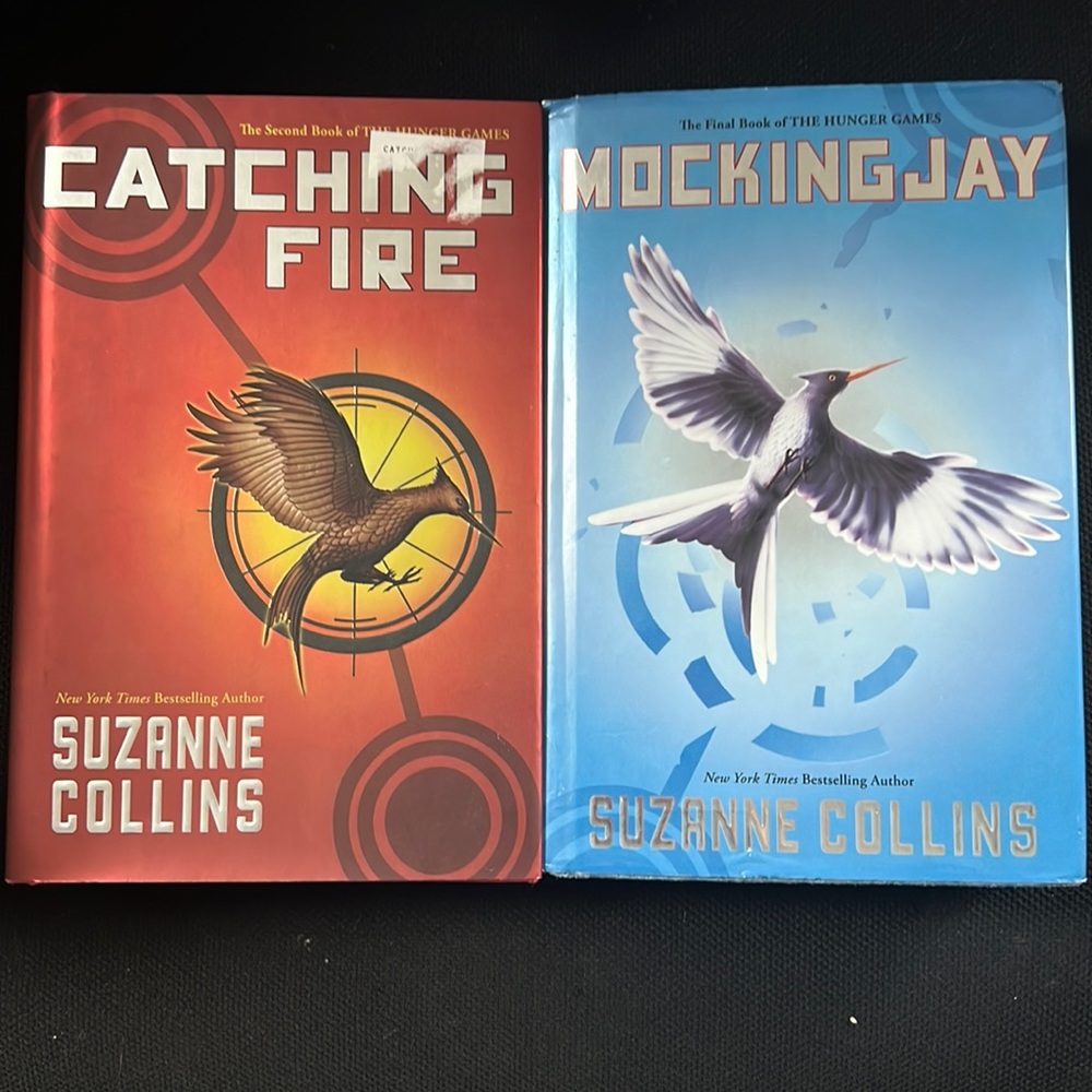 “Catching Fire” and “Mockingjay” by Suzanne Collins
